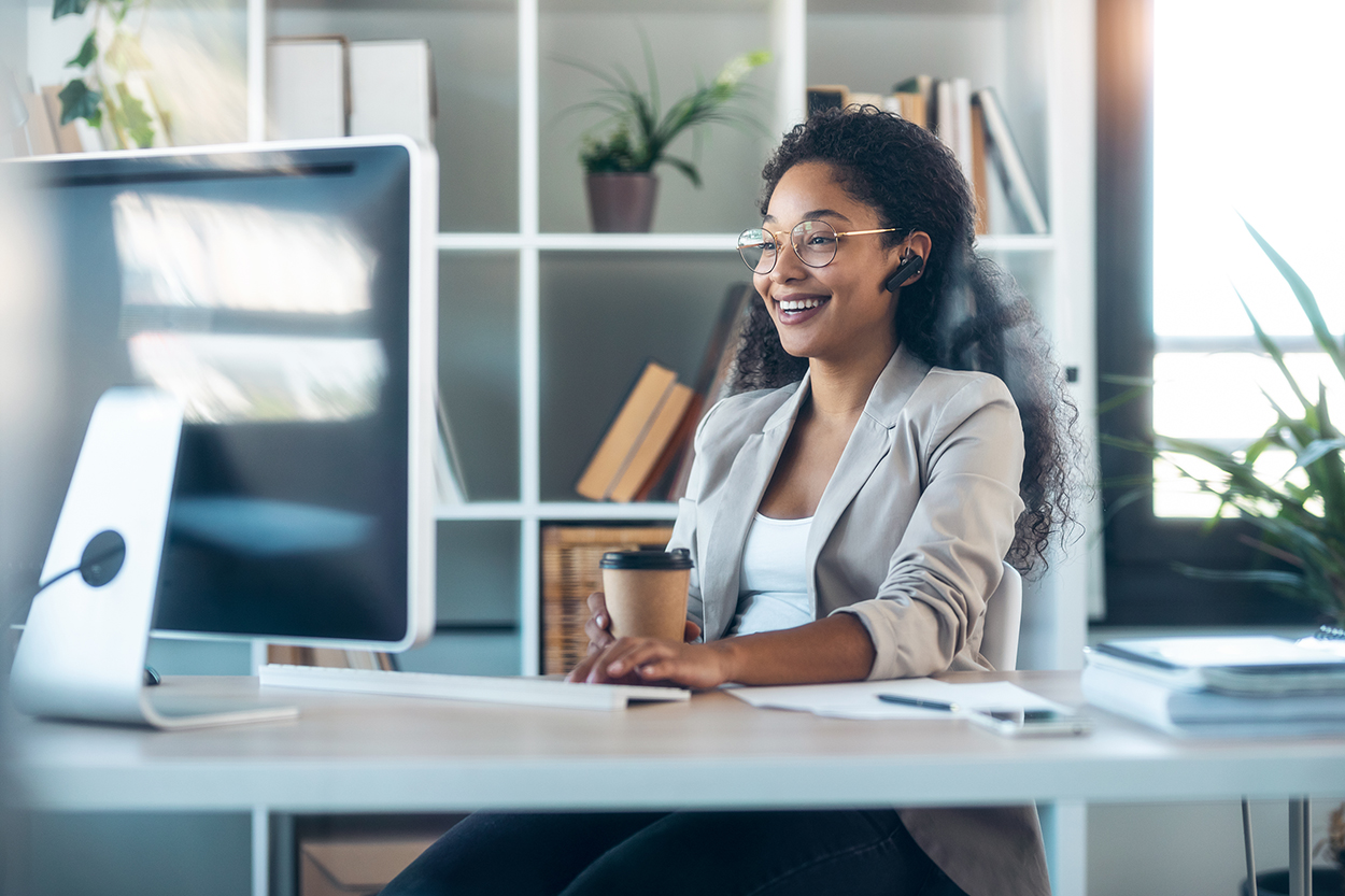 Elegant business woman working with computer while talking with meetings and event travel management